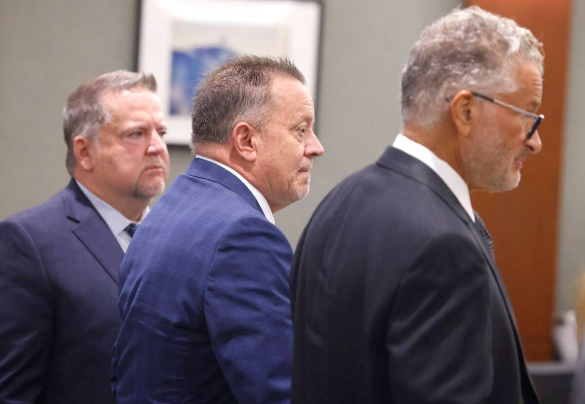 Former defense attorney Gary Guymon, center, accused of sex trafficking and plotting with felon ...