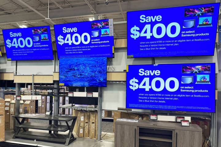 Flat screen TVs are displayed at a retail store in Vernon Hills, Ill., Thursday, Aug. 7, 2025. ...
