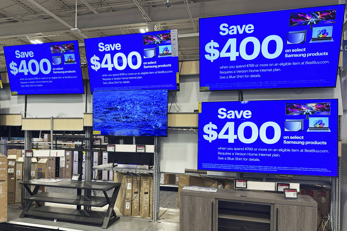 Flat screen TVs are displayed at a retail store in Vernon Hills, Ill., Thursday, Aug. 7, 2025. ...