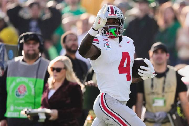FILE - Ohio State wide receiver Jeremiah Smith (4) gestures as he scores a touchdown during the ...