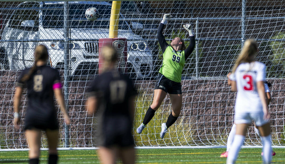 Faith Lutheran goalkeeper Olivia Petty (99) watches as a Coronado kick gets past for a score du ...