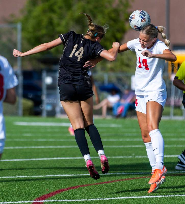 Faith Lutheran defender Kloe Abdalla (14) and Coronado midfielder Allison Kleiner (14) attempt ...