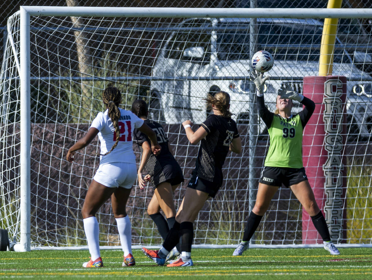 Faith Lutheran goalkeeper Olivia Petty (99) deflects a Coronado kick denying a score during the ...