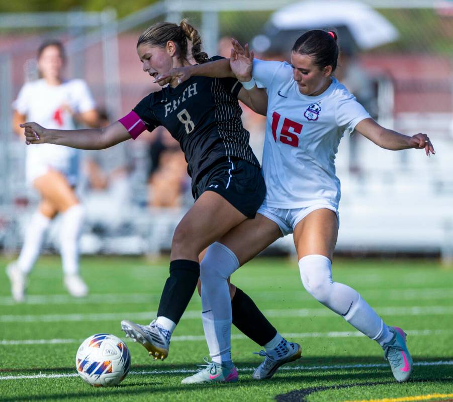 Faith Lutheran forward Olivia Stark (8) controls the ball over Coronado defender Jovie Poniewaz ...
