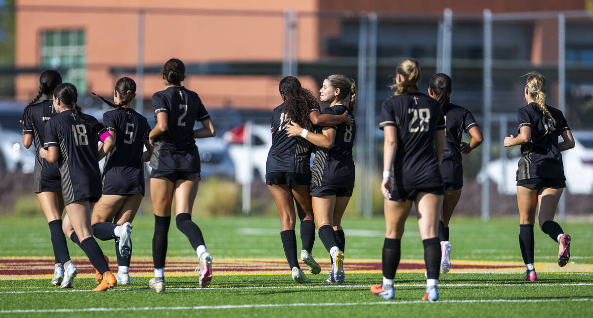Faith Lutheran players celebrate a second score over Coronado during the first half of their NI ...