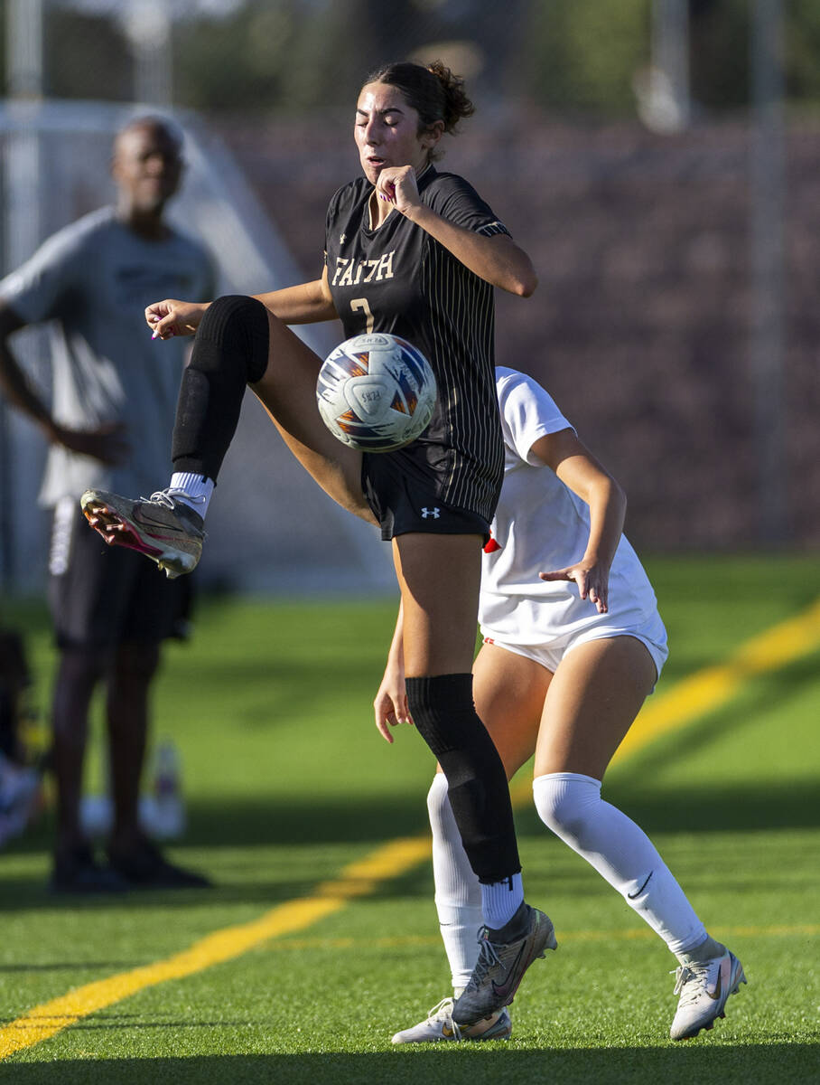 Coronado Faith Lutheran forward Elliott Lujan (2) secures the ball against Coronado defender El ...