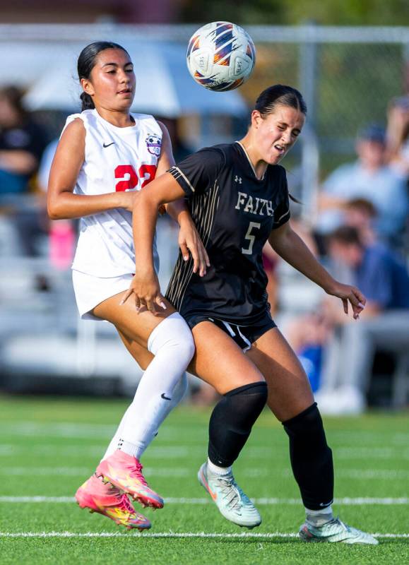 Faith Lutheran defender Posie Armstrong (5) looks to control the ball while battling Coronado f ...