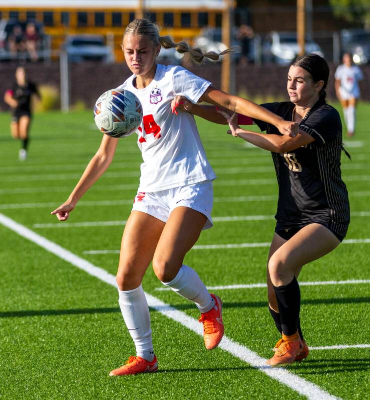 Coronado midfielder Allison Kleiner (14) controls the ball against Faith Lutheran defender Addi ...