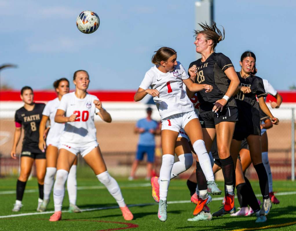Faith Lutheran forward Allie Rabe (28) heads the ball away from Coronado midfielder Taytum Aren ...