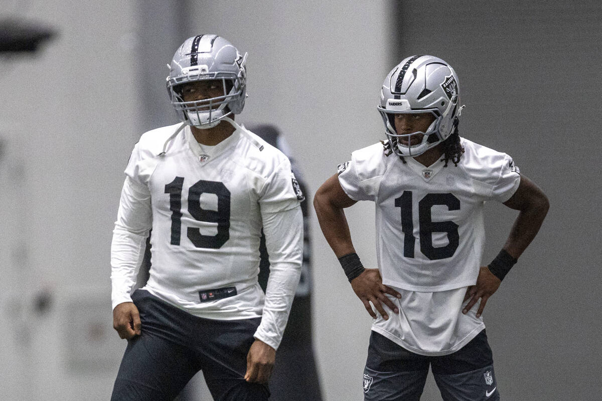 Raiders wide receiver Amari Cooper (19) and wide receiver Jakobi Meyers (16) stretch during a t ...