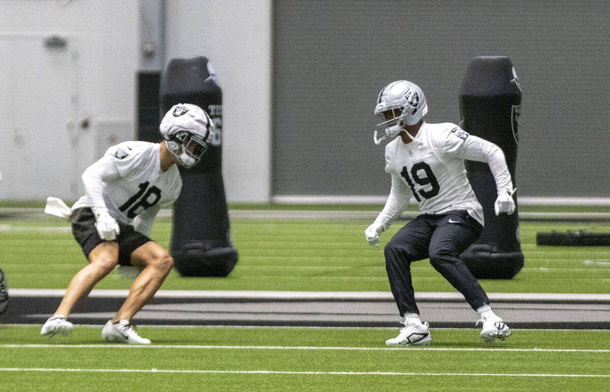 Raiders wide receivers Jack Bech (18) and Amari Cooper (19) run during a team practice at the I ...