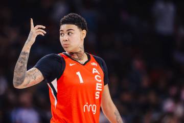 Aces forward Kierstan Bell signals to a teammate during a WNBA basketball game between the Aces ...