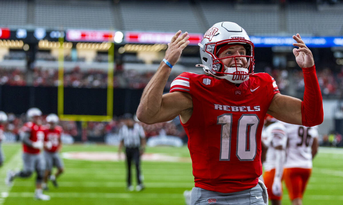UNLV quarterback Anthony Colandrea (10) is pumped up and reacts with the fans after another sco ...