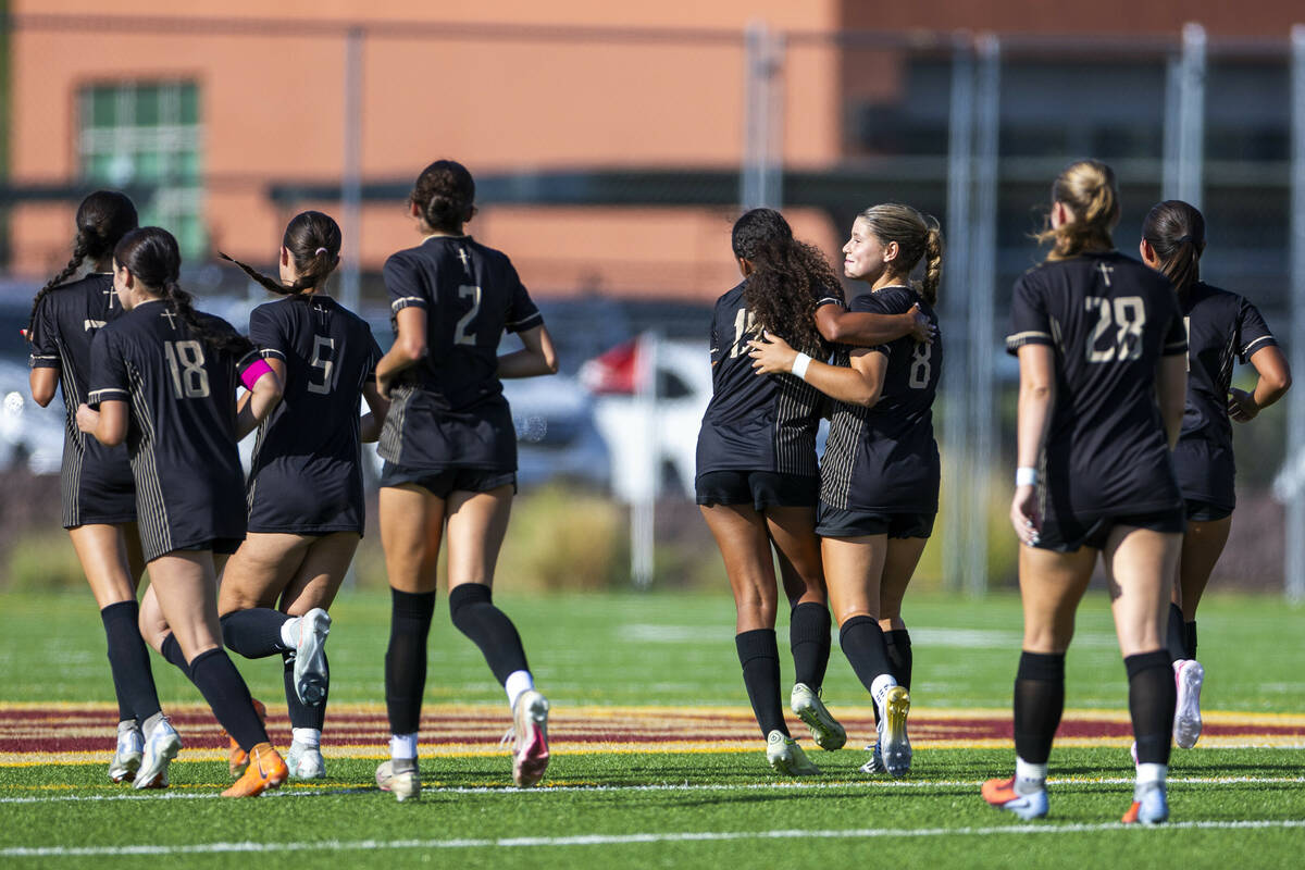 Faith Lutheran players celebrate a second score over Coronado during the first half of their NI ...