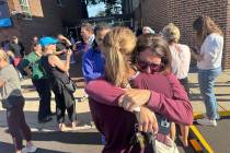 Parents await news of their children after a reported mass shooting at Annunciation Church on W ...