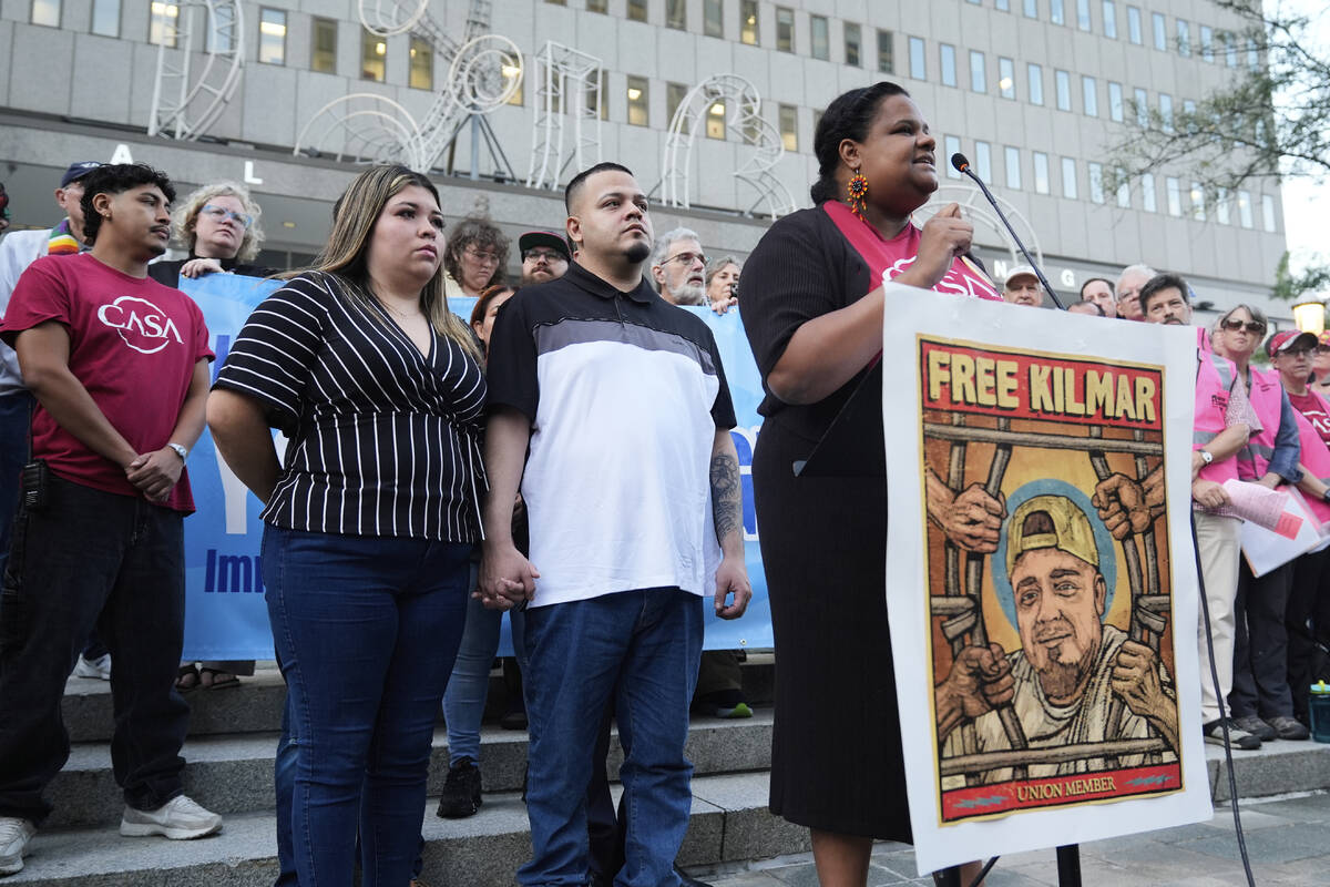 Jennifer Vasquez Sura, front left, and her husband Kilmar Abrego Garcia, front center, attend a ...