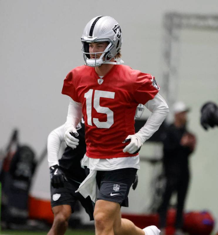 Raiders backup quarterback Kenny Pickett (15) warms up during team practice at the Intermountai ...