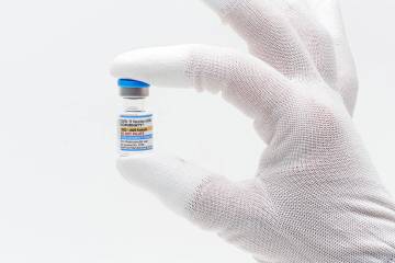 This photo provided by Pfizer in August 2025 shows a vial of the updated COVID-19 vaccine Comir ...