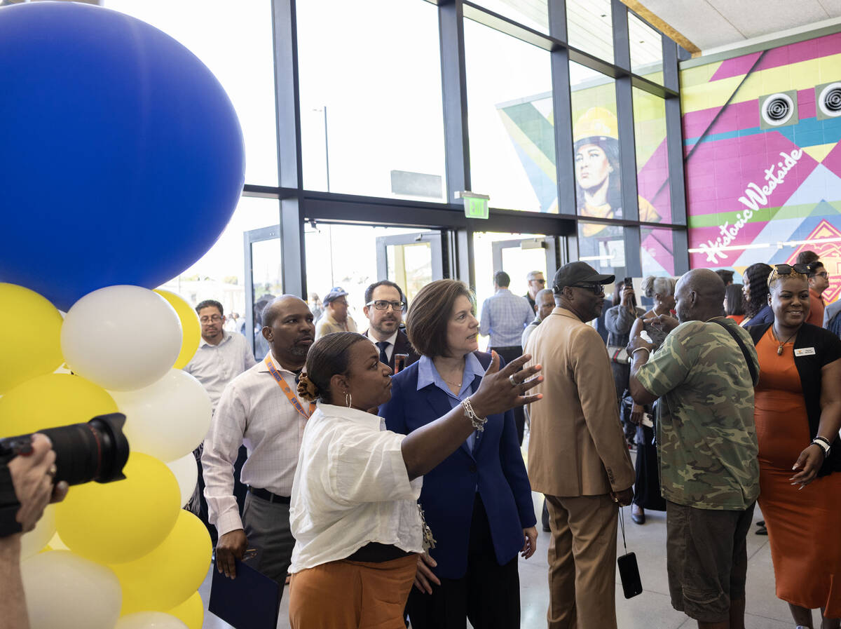 CSN events manager Michelle Word, left/front, provides a tour to Sen. Catherine Cortez Masto (D ...