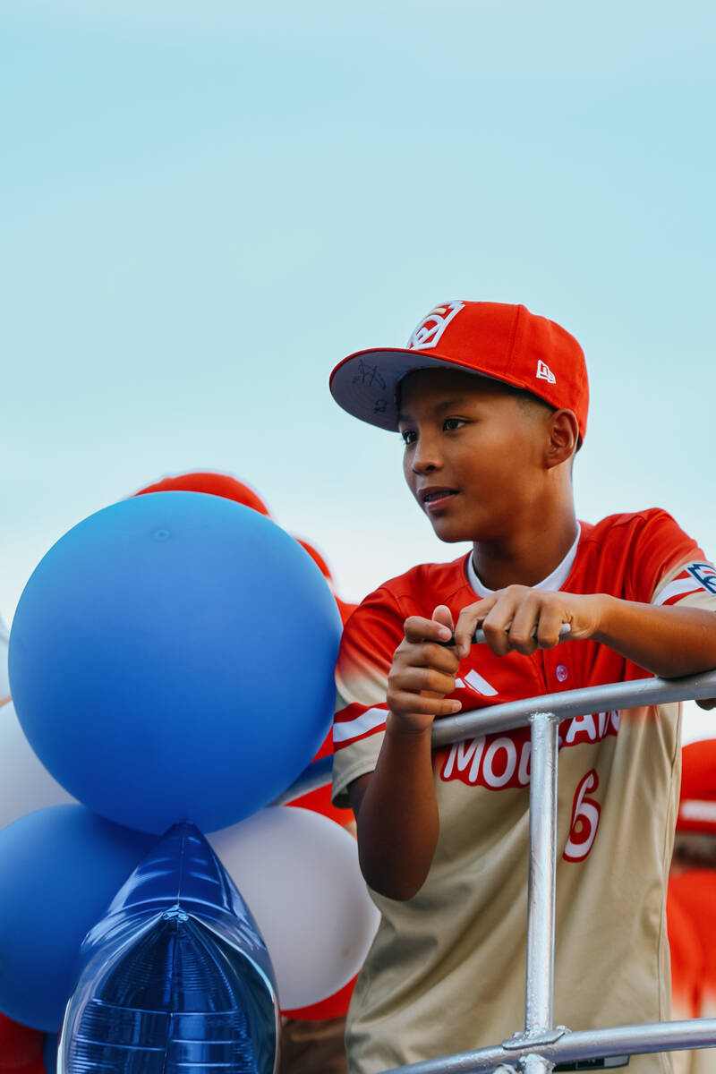Cutter Ricafort looks out from a float during the parade for the Summerlin South Little League ...