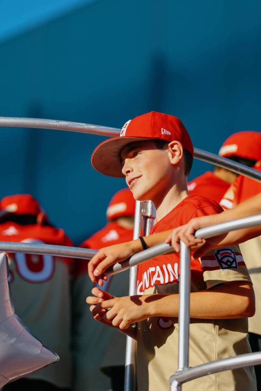 Luke D’Ambrosio smiles at families cheering on the team during the parade for the Summer ...