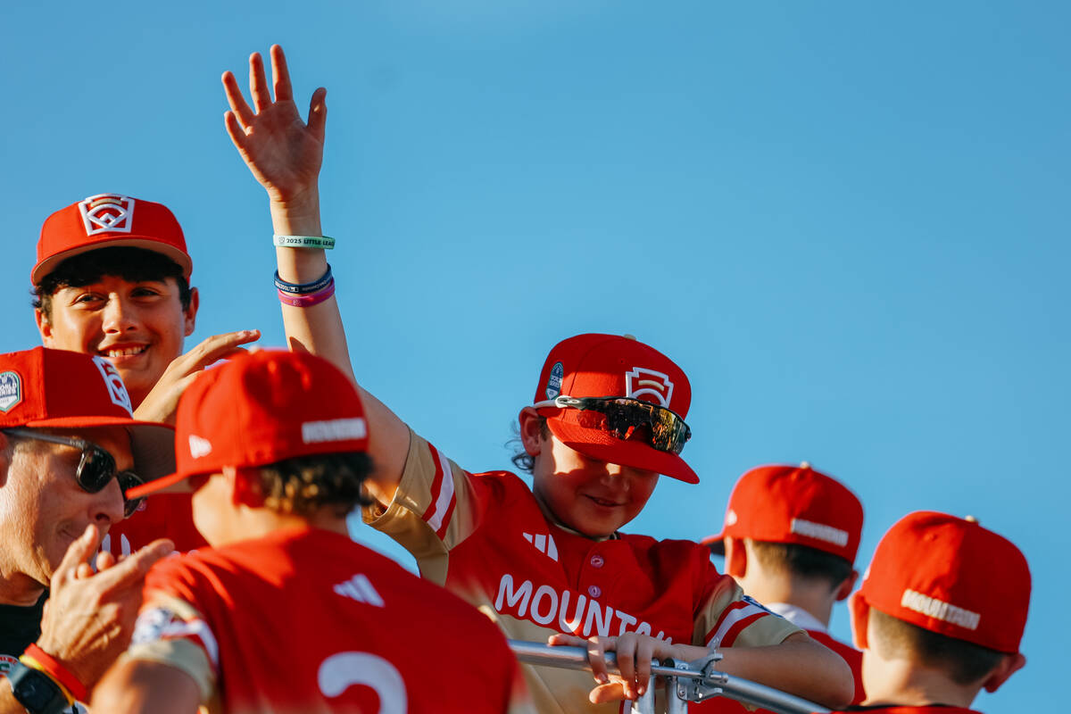 Dustin Greusel waves as he is introduced during the parade for the Summerlin South Little Leagu ...