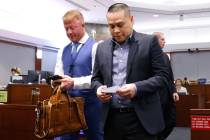 Uber driver Kevin Vo, right, walks out of a courtroom with his attorney Justin Wilson after he ...