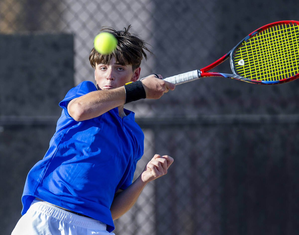 Bishop Gorman's Lucas Rago returns a ball against Faith Lutheran during their singles NIAA tenn ...