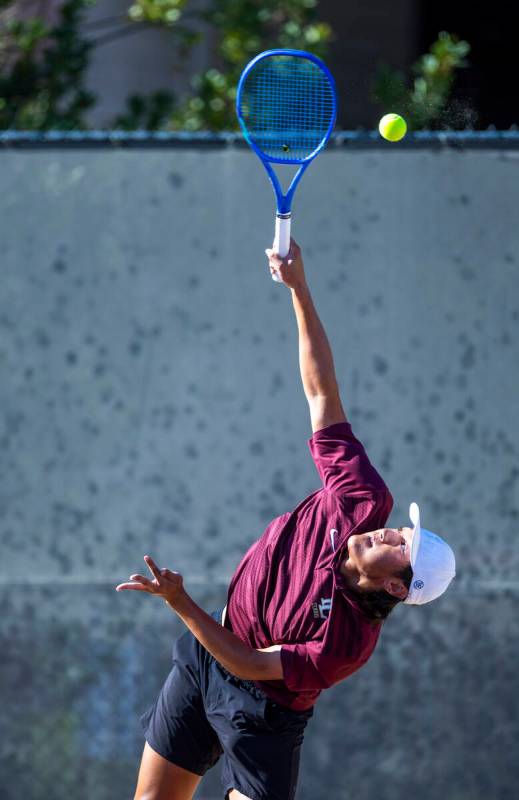Faith Lutheran's Alpha Vonxaiburana serves a ball against Bishop Gorman during their singles NI ...