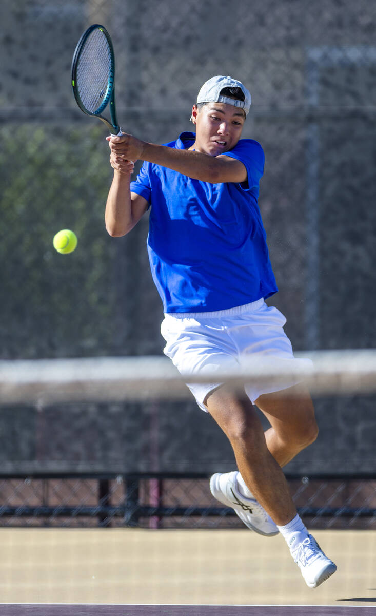 Bishop Gorman's Shawn DeMilliano returns a ball against Faith Lutheran during their singles NIA ...