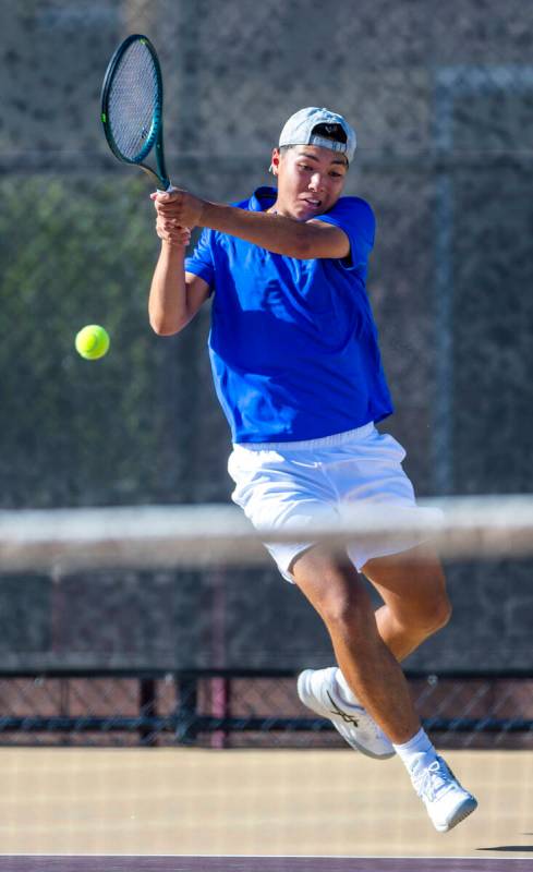 Bishop Gorman's Shawn DeMilliano returns a ball against Faith Lutheran during their singles NIA ...
