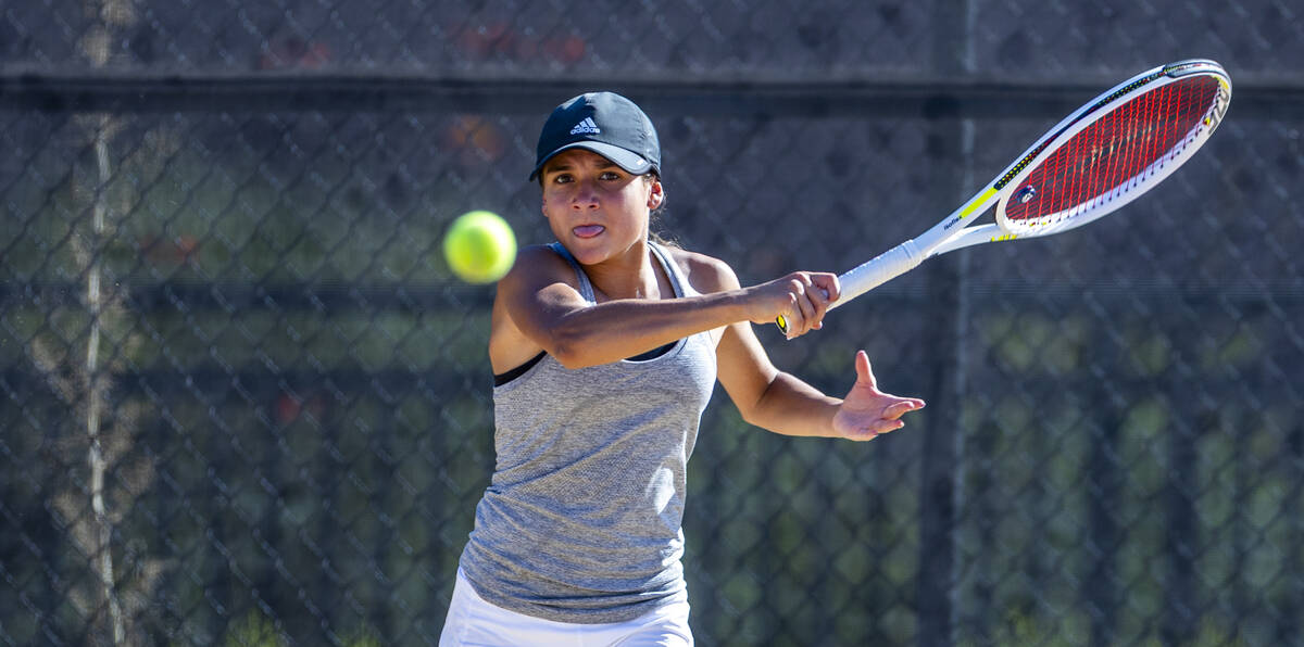 Bishop Gorman's Victoria Perez eyes a returned ball against Faith Lutheran during their singles ...