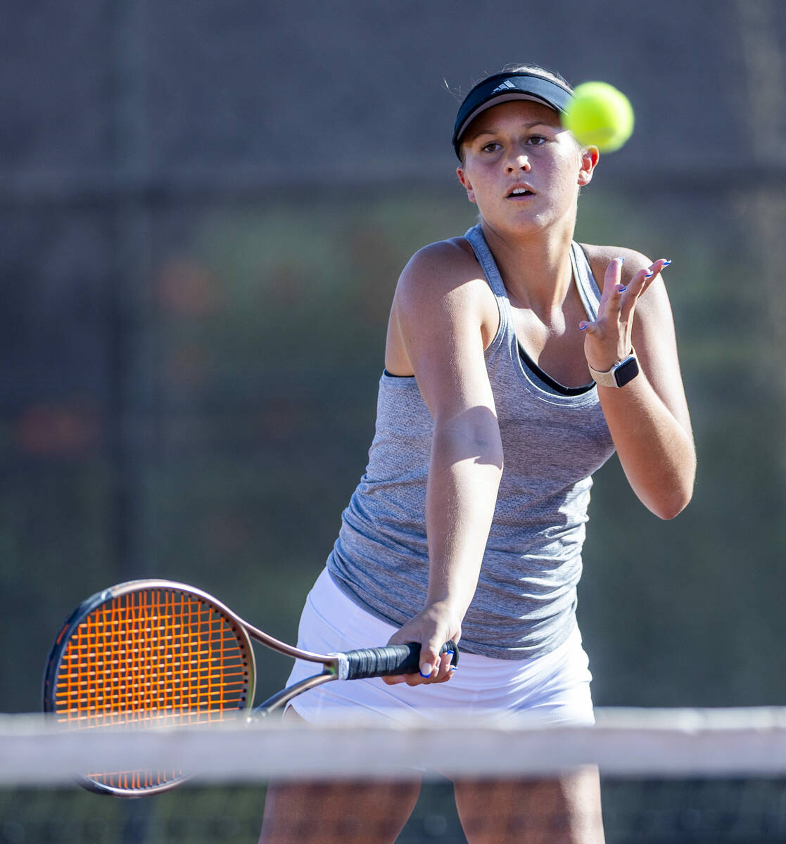 Bishop Gorman's Allie Miller eyes a returned ball against Faith Lutheran during their doubles N ...