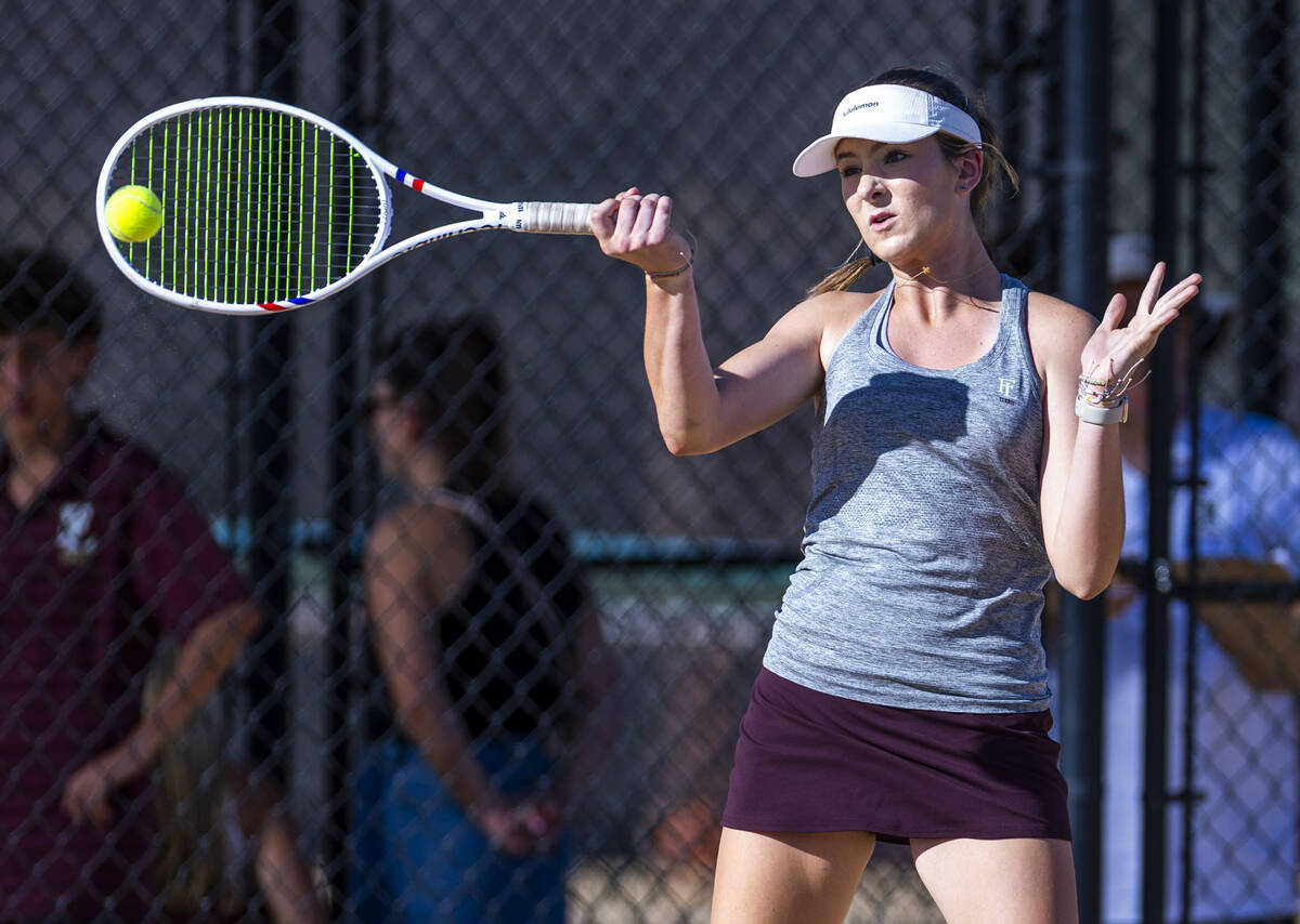 Faith Lutheran's Ella Vreeling returns a ball against Bishop Gorman during their doubles NIAA t ...