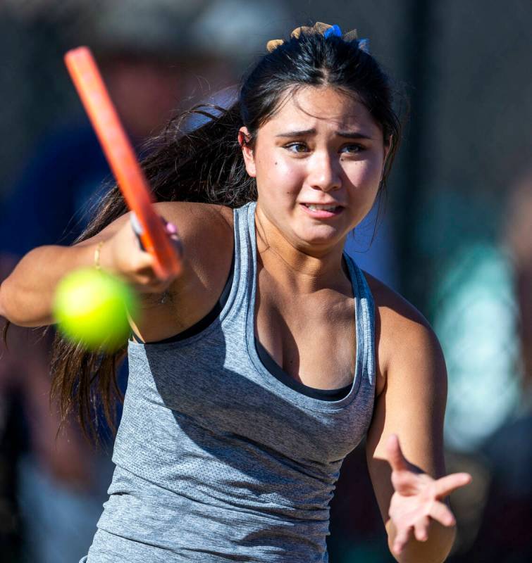 Bishop Gorman's Sophia Michaels returns a ball against Faith Lutheran during their doubles NIAA ...