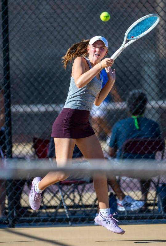Faith Lutheran's Izzy Cole returns a ball against Bishop Gorman during their doubles NIAA tenni ...