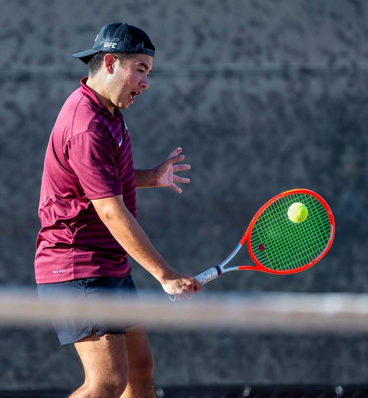 Faith Lutheran's Sam Gastaldo returns a ball against Bishop Gorman during their doubles NIAA te ...