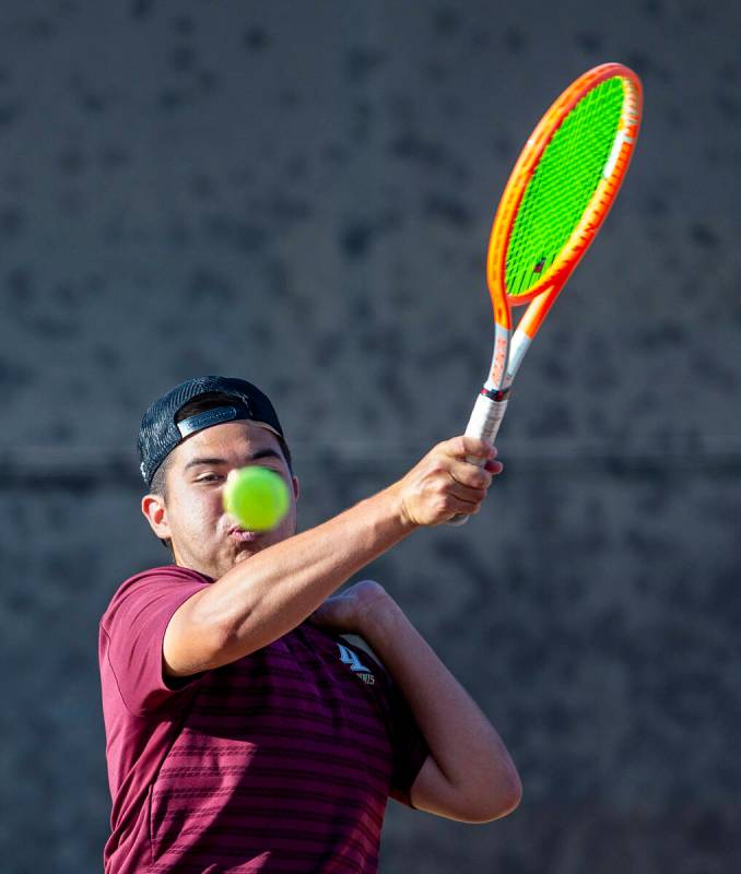 Faith Lutheran's Sam Gastaldo returns a ball against Bishop Gorman during their doubles NIAA te ...