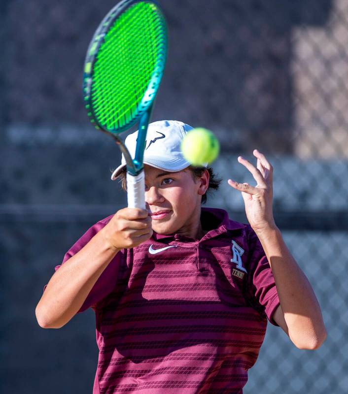 Faith Lutheran's Tyson Young returns a ball against Bishop Gorman during their singles NIAA ten ...