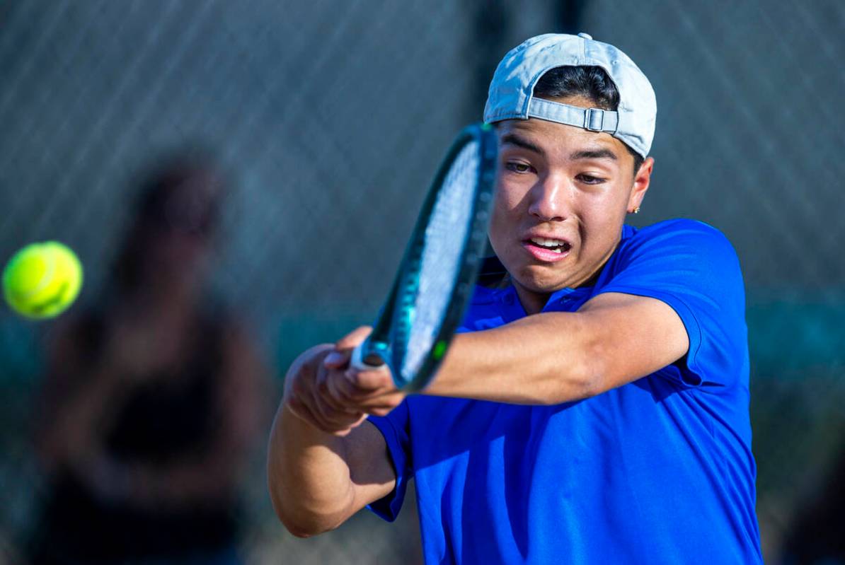 Bishop Gorman's Shawn DeMilliano returns a ball against Faith Lutheran during their singles NIA ...