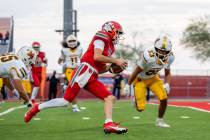 Arbor View Quarterback Thaddeus Thatcher (7) approaches the end zone during a football game bet ...