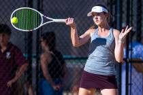 Faith Lutheran's Ella Vreeling returns a ball against Bishop Gorman during their doubles NIAA t ...