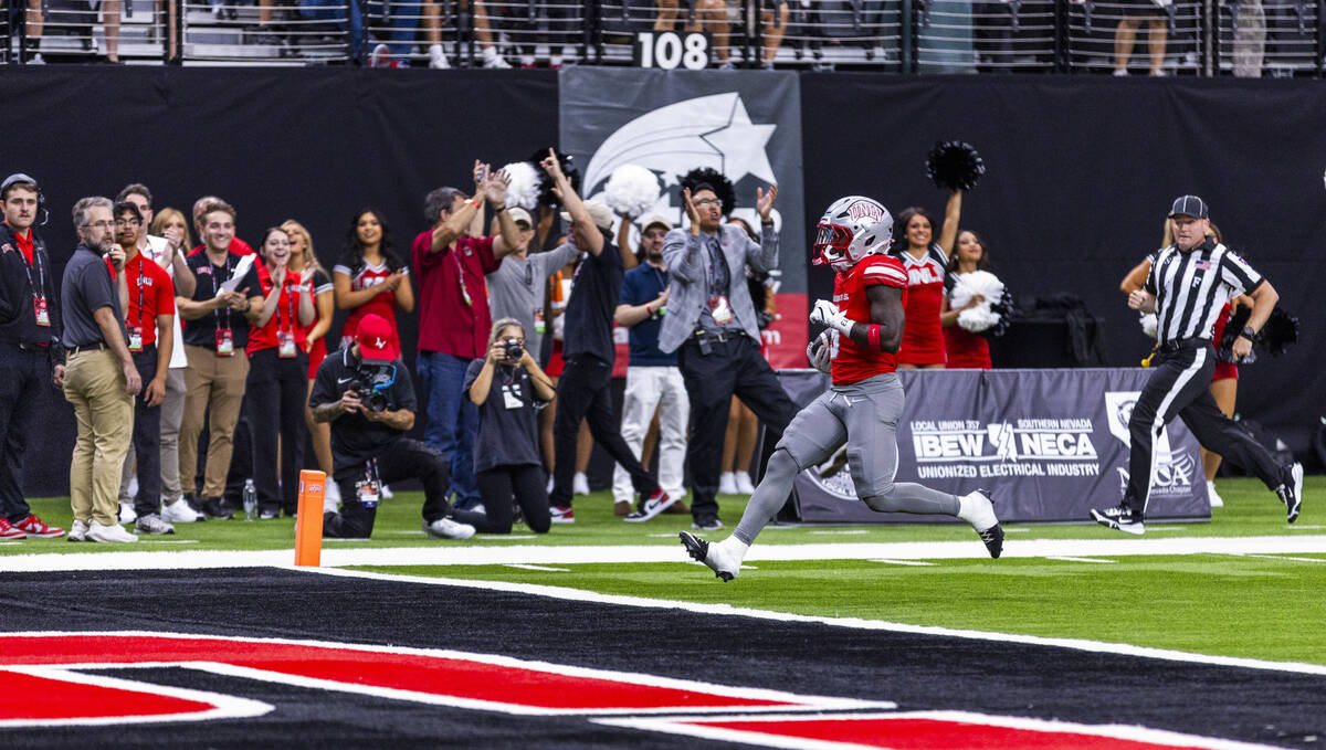 UNLV running back Jai'Den Thomas (9) scores after another long run against the Idaho State Beng ...