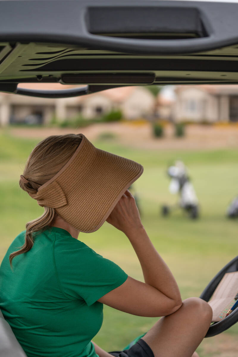 Parents watch a Class 5A Desert League girls golf match at Highland Falls Golf Club in Las Vega ...
