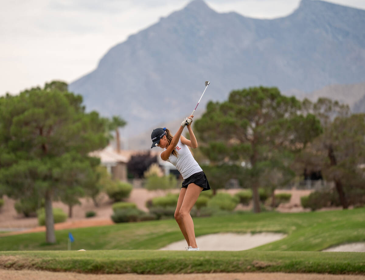 Ellie Prosser tees off during a Class 5A Desert League girls golf match at Highland Falls Golf ...