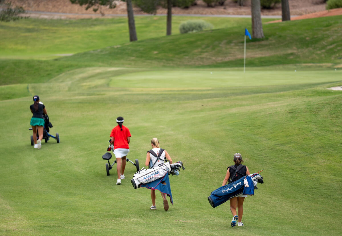 The third group of golfers moves to the next hole during a Class 5A Desert League girls golf ma ...