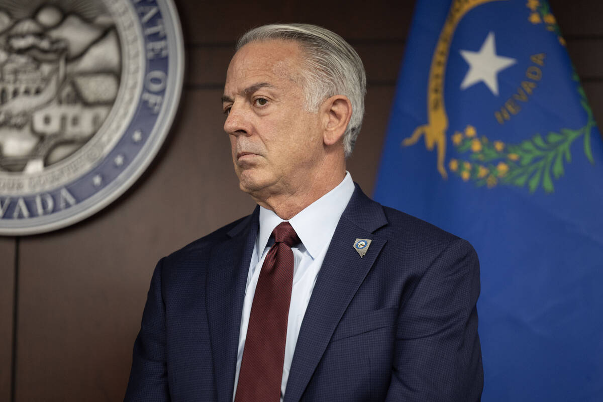 Gov. Joe Lombardo listens to a fellow speaker during a press conference about the recent cybera ...