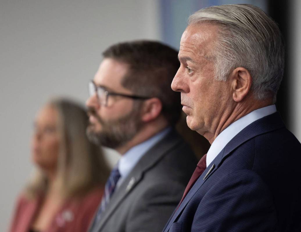 Gov. Joe Lombardo listens to a fellow speaker during a press conference about the recent cybera ...