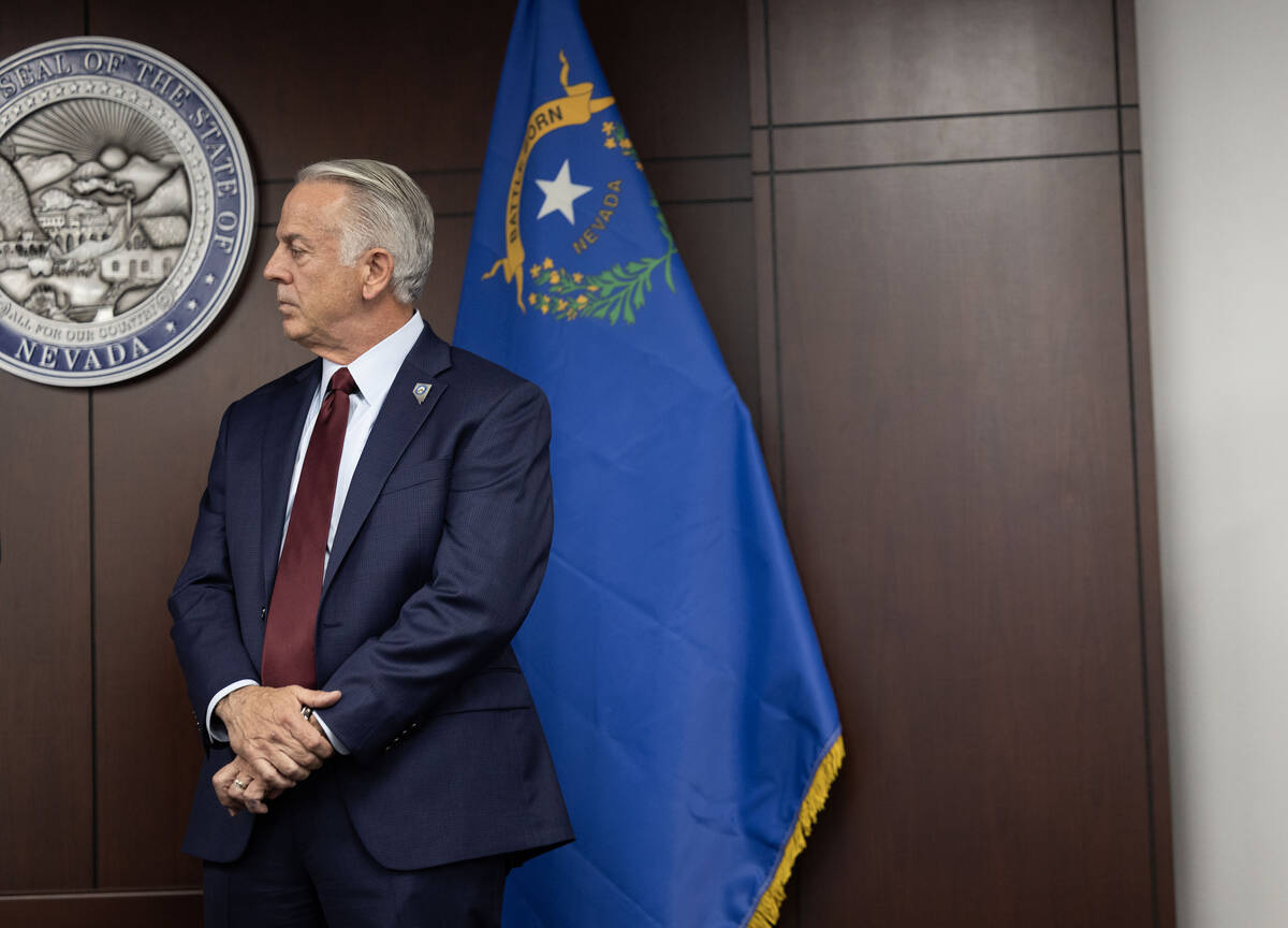 Gov. Joe Lombardo listens to a fellow speaker during a press conference about the recent cybera ...
