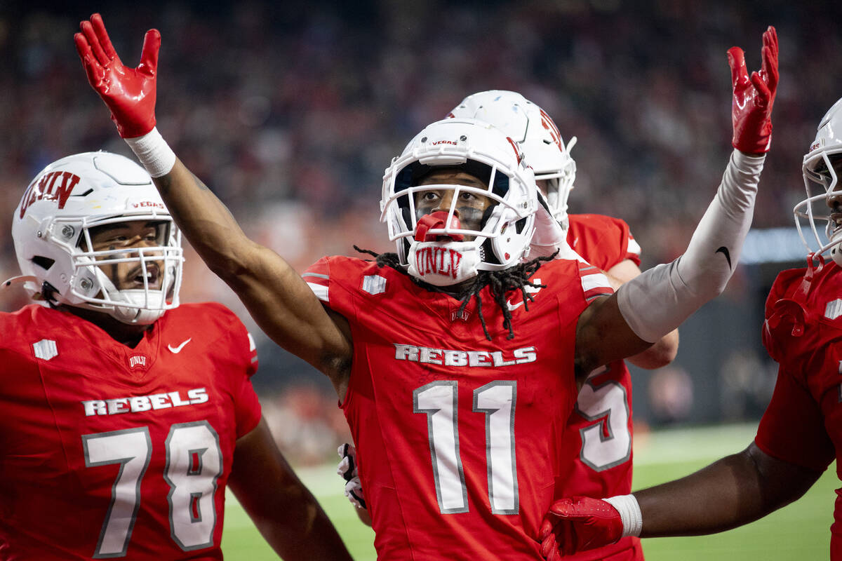 UNLV wide receiver Ricky White III (11) celebrates after scoring a touchdown during the college ...